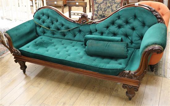 A Victorian mahogany scroll arm chaise longue, raised on turned fluted legs